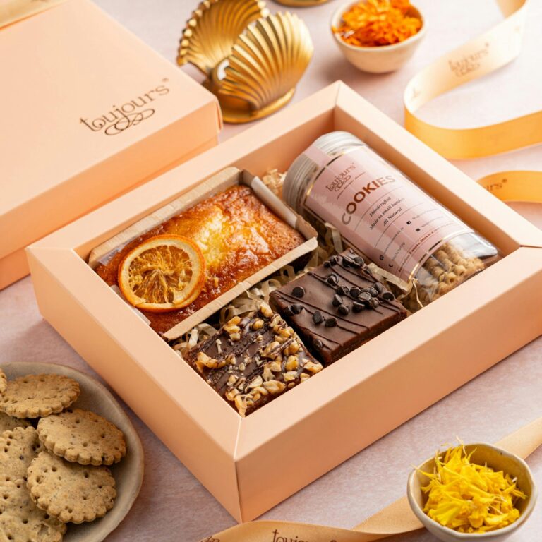 Elegant gift box with baked goods and sweets, perfect for celebrations and gifting.