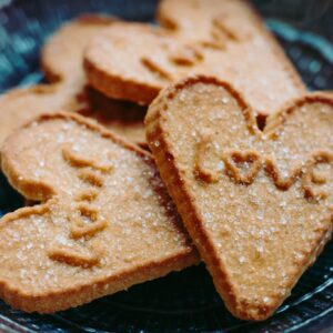 Homemade heart-shaped cookies with sugar topping, perfect for Valentine's Day.