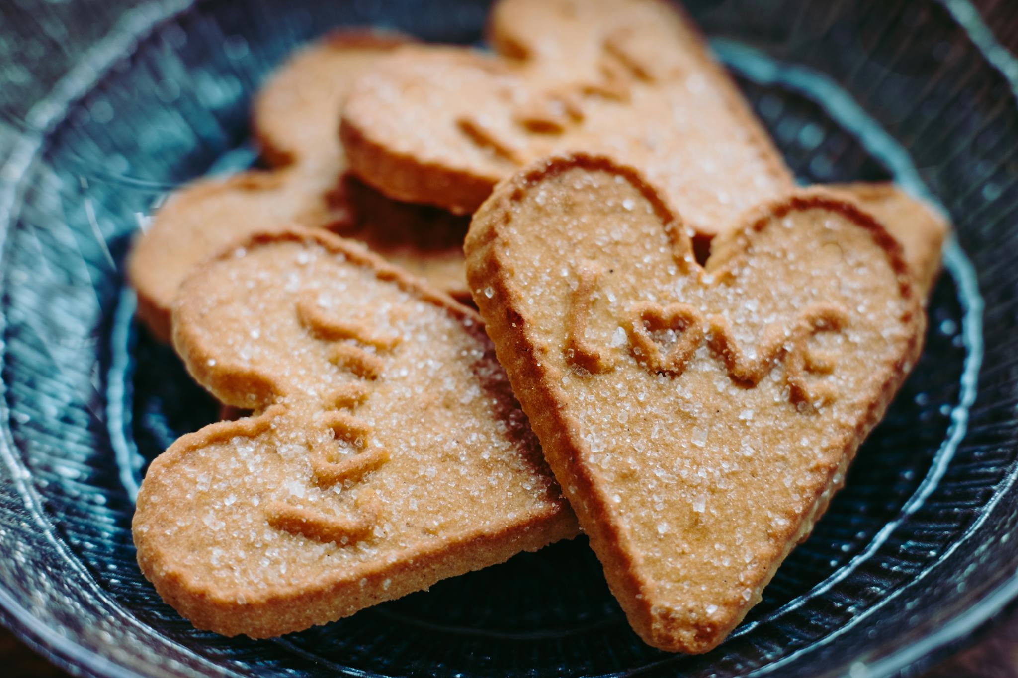 Homemade heart-shaped cookies with sugar topping, perfect for Valentine's Day.